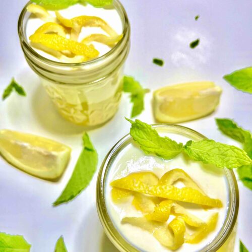 lemon pudding with garnishes in mason jars