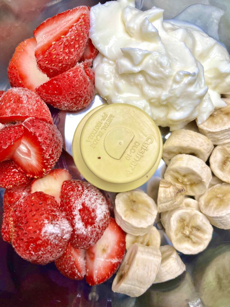 strawberries, banana and yogurt in blender