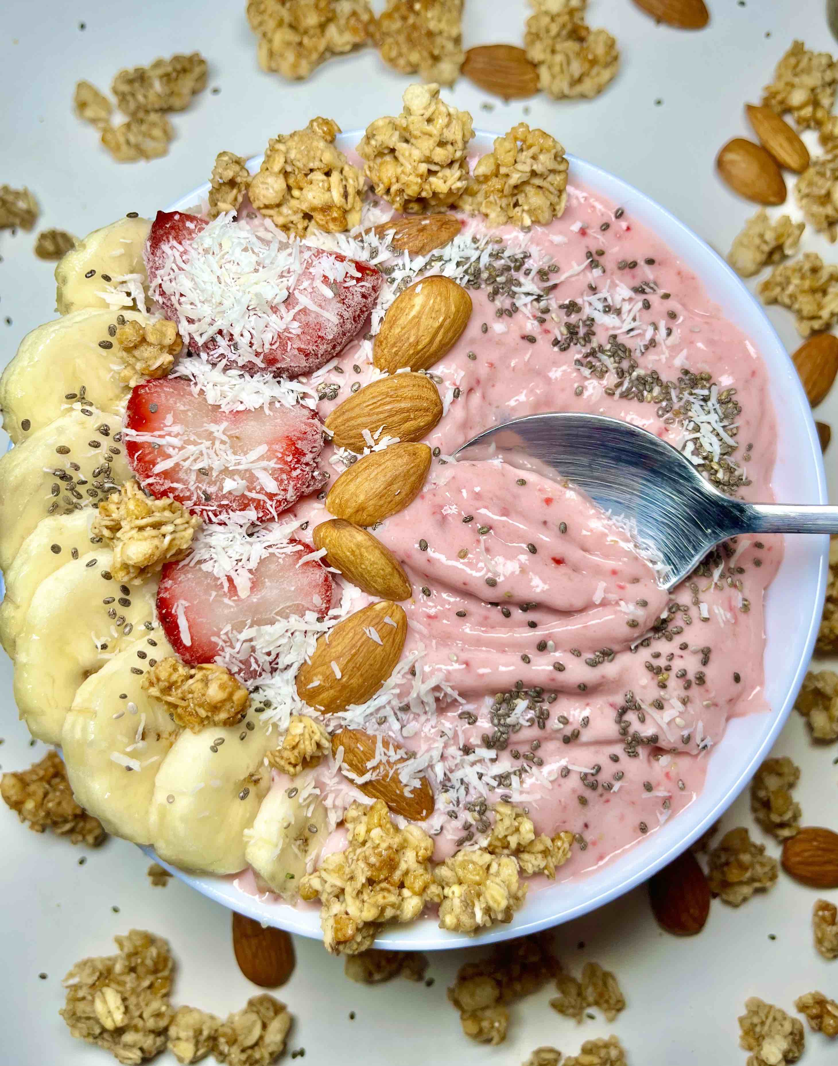strawberry banana smoothie bowl with spoon