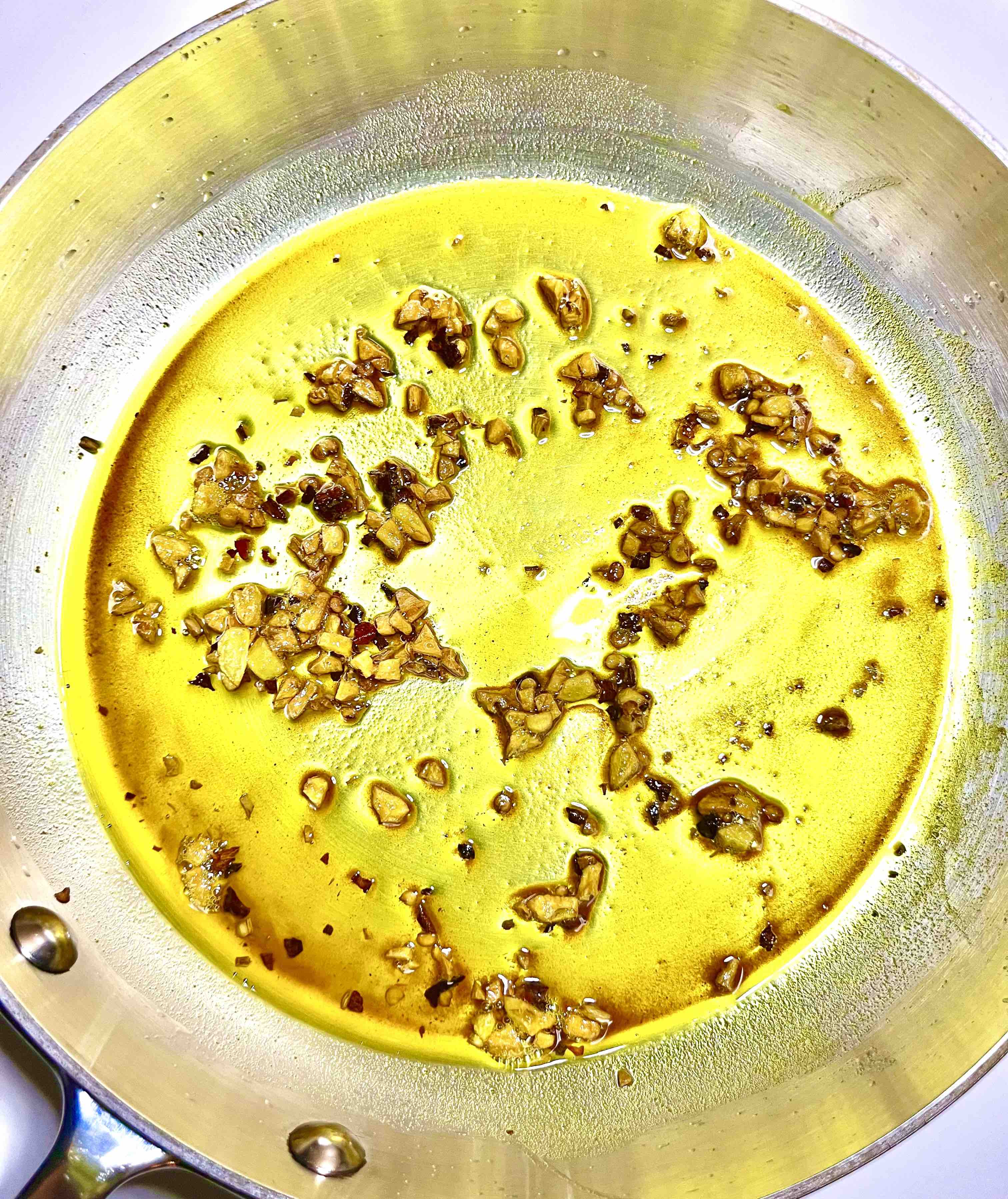 pan with dressing being sauted