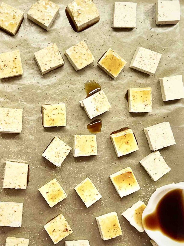 tofu cubes on baking sheet before baking