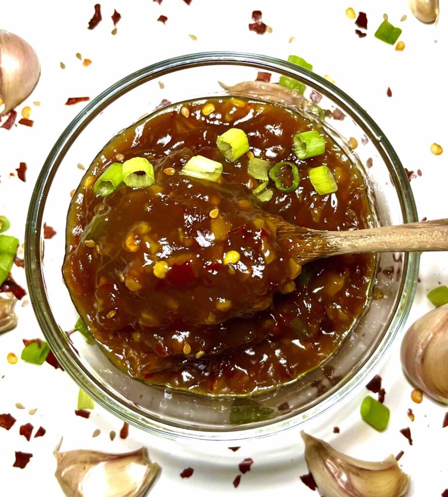 spoon inside bowl of chinese garlic sauce