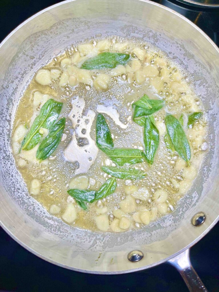 sauteed garlic and sage in skillet