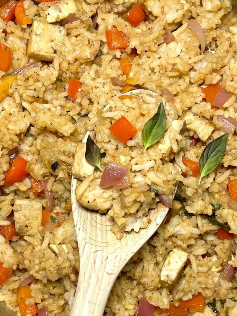 close-up of spoonful of thai basil fried rice