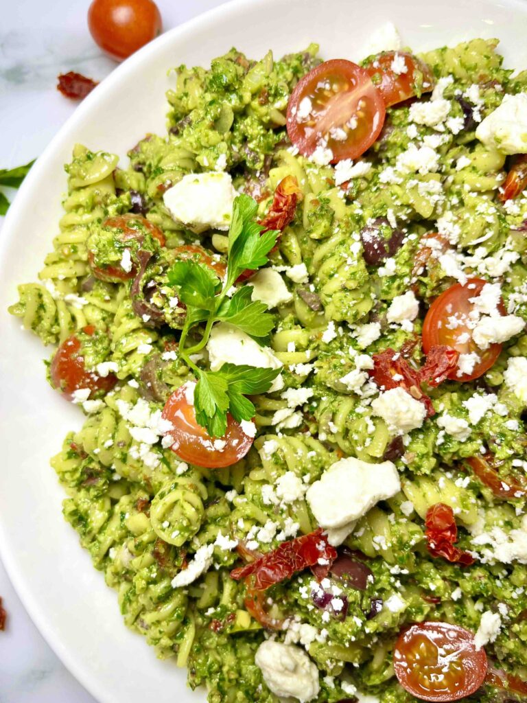 plate of parsley pesto pasta salad seen from above