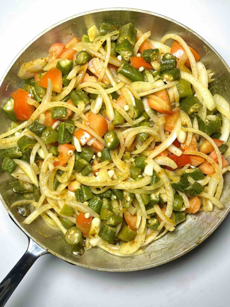 cooked okra masala in pan seen from above